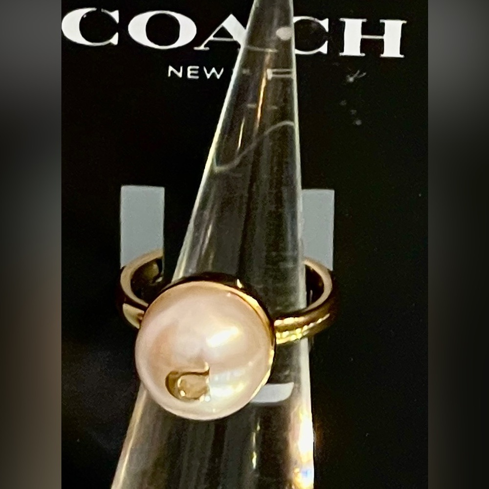 Coach NWT Pearl Ring Gold band/gold Logo “C” sits in middle of large faux pearl